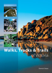 The cover image featuring a rocky beach embankment reflected in bright blu