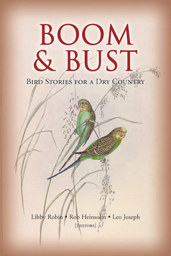 The cover image of Boom and Bust, featuring two budgerigars holding on to thick grass shoots.
