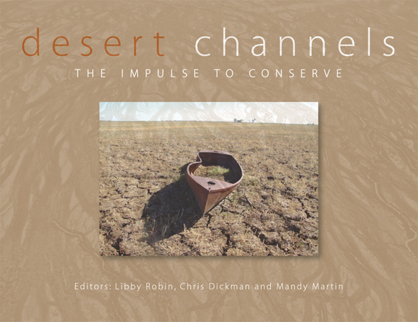 The cover image of Desert Channels, featuring a canoe on dried cracked earth set in a sandy boarder.