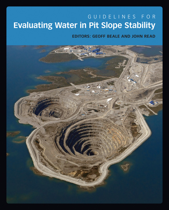 The cover image of Guidelines for Evaluating Water in Pit Slope Stability, features an arial view of two layered grey pits on the edge of land surroun