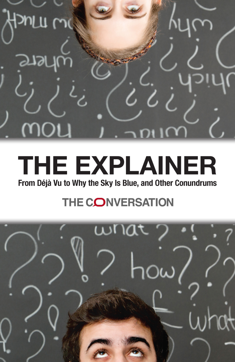 Cover image of The Explainer, featuring the tops of two male heads, at the top of the book is a blonde man looking down, at the bottom a brunette man