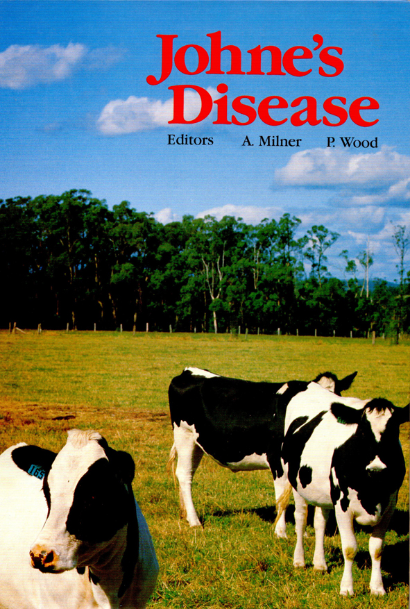 The cover image featuring three black and white cows in the immediate foreground, with lime green grass, dark green trees and bright blue sky in the b