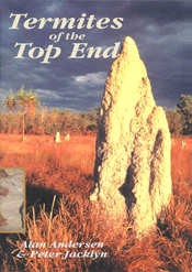 The cover image featuring a large termite tower, in red grass, with dark grey clouded sky in the background.