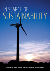 The cover image of In Search of Sustainability, featuring a wind turbine silhouette against a blue and partially cloudy setting sun sky.