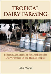 The cover image of Tropical Dairy Farming, featuring white and black cows
