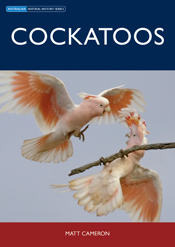 The cover image of Cockatoos, featuring two pale pink cockatoos with their wings spread, one in flight over the other which is clutching a thin branch