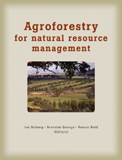 The cover image featuring a center image of green fields with tall pine tr