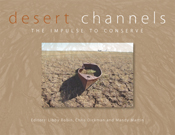 The cover image of Desert Channels, featuring a canoe on dried cracked ear