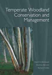 The cover image of Temperate Woodland Conservation and Management, featuring streaked tree trunks, set into a plain grey frame.
