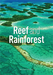 The cover image of Reef and Rainforest, features an arial view of clear br