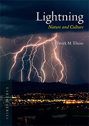 Fork lightning striking over a darkened landscape at night.