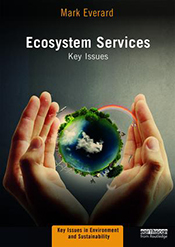 Cover with hands cupping an image of a globe against a dark background.