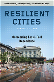 Cover image featuring streetscape and text on blue sky.