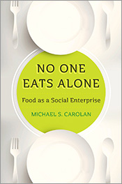 Cover featuring white dinner plates top and bottom on white background wit