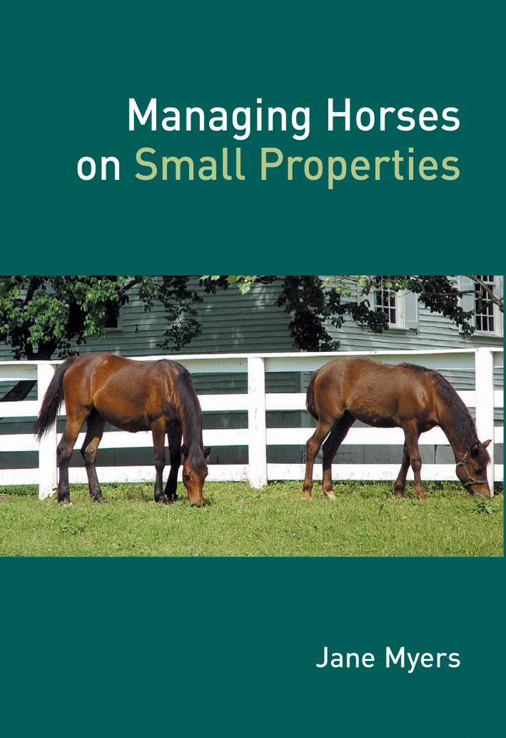 The cover image featuring two brown horses grazing on green grass, with a white paneled fence background.