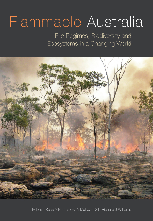 The cover image of Flammable Australia, features a photograph of bushland on fire, there are rocks in the foreground and burning trees, orange flames