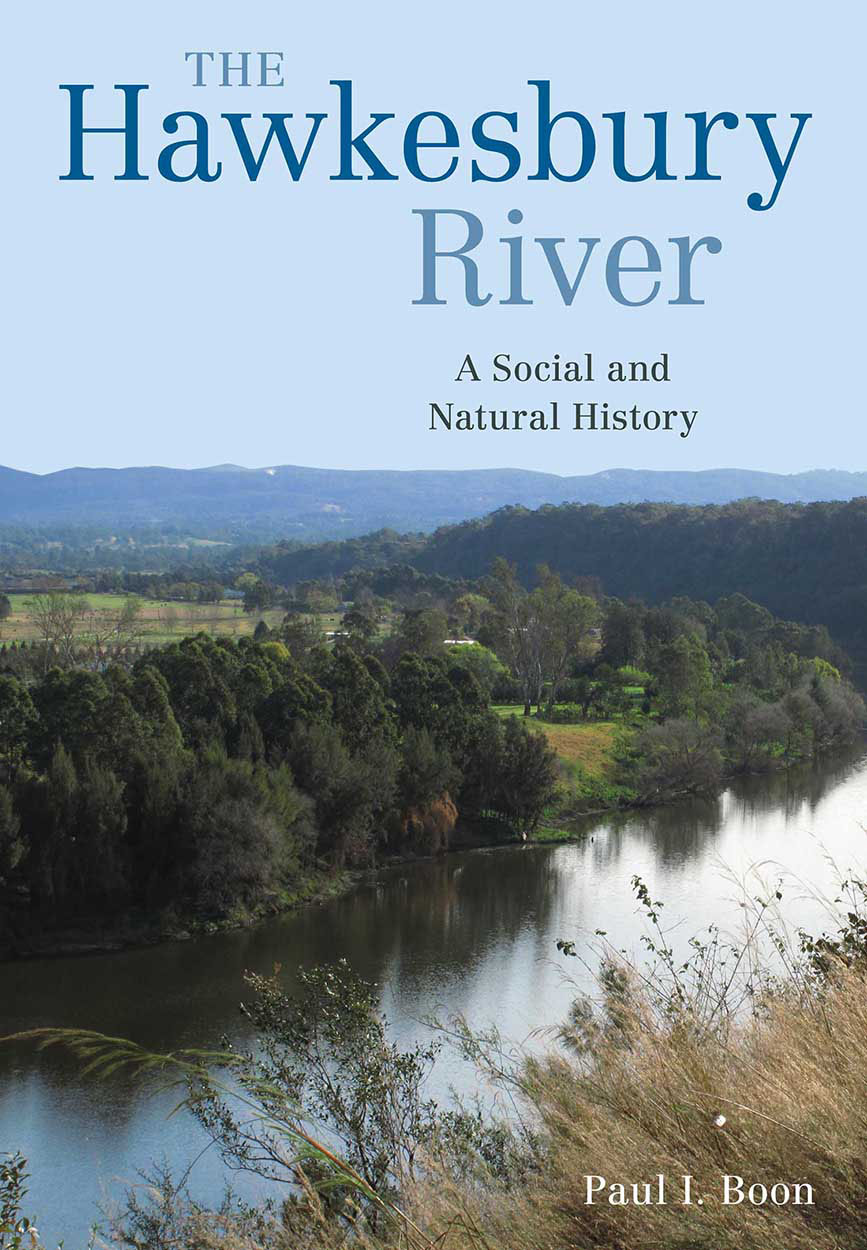 Cover image with a photo of a sweeping river view from a raised river bed with waving grass in the foreground.