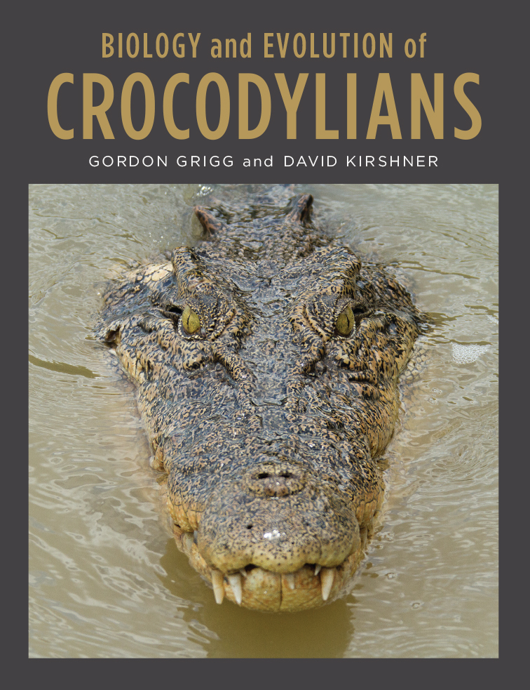 Cover image of Biology and Evolution of Crocodylians, featuring the head of a saltwater crocodile in water