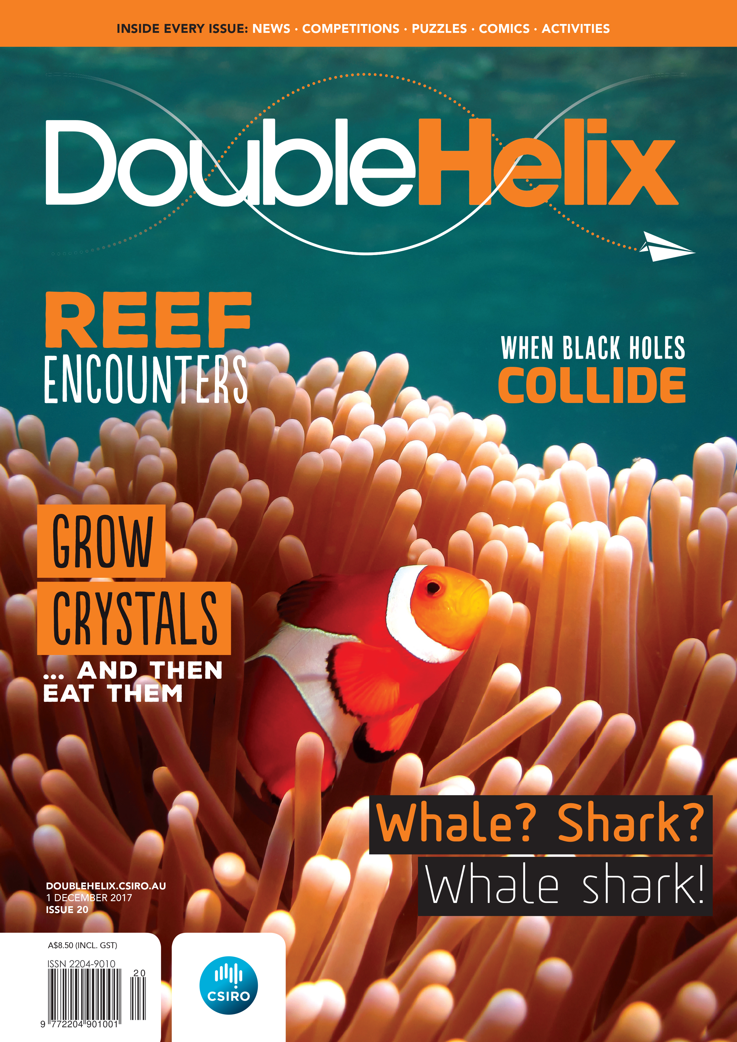 Cover of magazine with clown fish swimming in anemone.