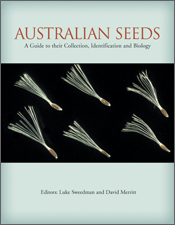 The cover image of Australian Seeds, featuring six seeds with fine white hairs, set against a plain black background.