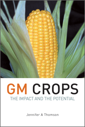 The cover image of GM Crops, featuring a large cob of yellow corn, surrounded by its leaves, against a plain black background.
