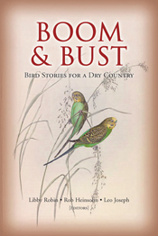 The cover image of Boom and Bust, featuring two budgerigars holding on to