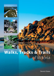 The cover image featuring a rocky beach embankment reflected in bright blue water, with a bright blue sky.