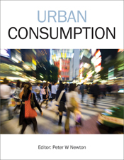 The cover image featuring a blurred view of pedestrians crossing a road in a built up and brightly lit city.