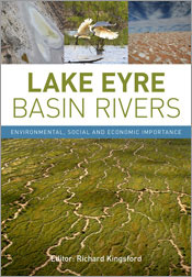 Cover featuring a large aerial photo of river beds running through a green