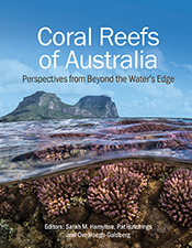 Cover of 'Coral Reefs of Australia', featuring a photo of a coral reef underwater with an island above the water in the background.