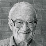 Photograph of Ben Gascoigne as a smiling elderly man wearing spectacles.